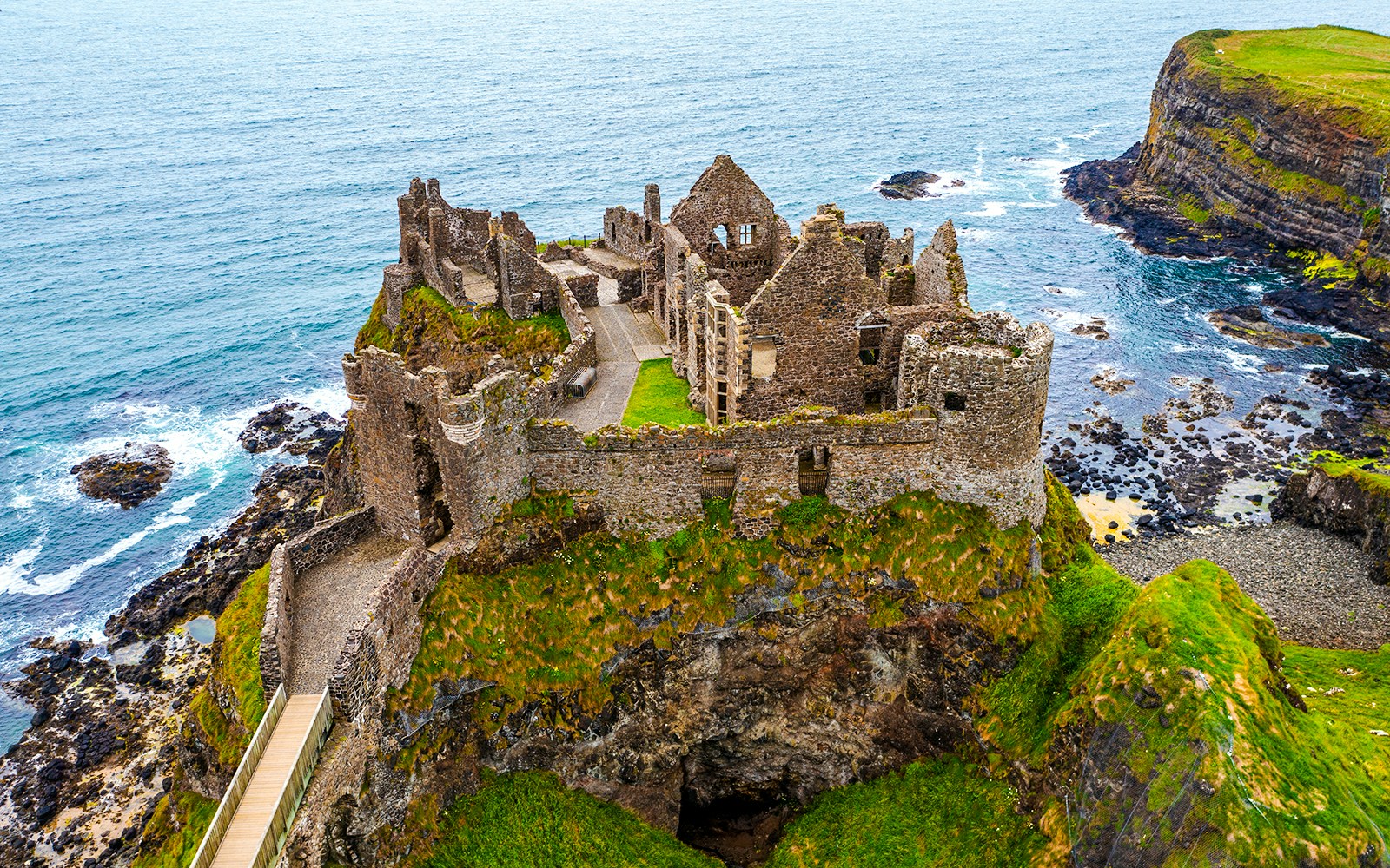 Dunluce Castle ruins on a coastal cliff in Northern Ireland.