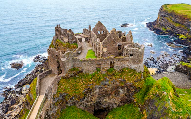Dunluce Castle ruins on a coastal cliff in Northern Ireland.