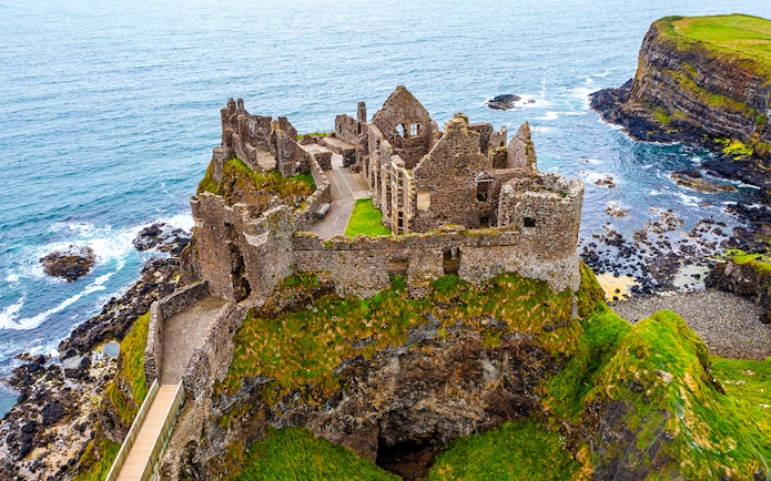 Dunluce Castle ruins on a coastal cliff in Northern Ireland.