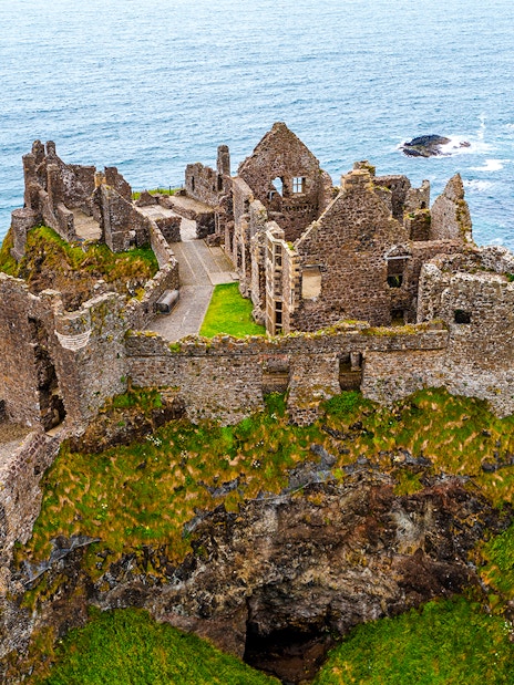 Dunluce Castle ruins on a coastal cliff in Northern Ireland.