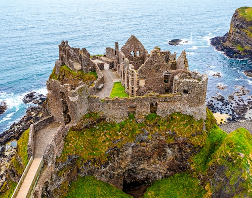 Dunluce Castle ruins on a coastal cliff in Northern Ireland.