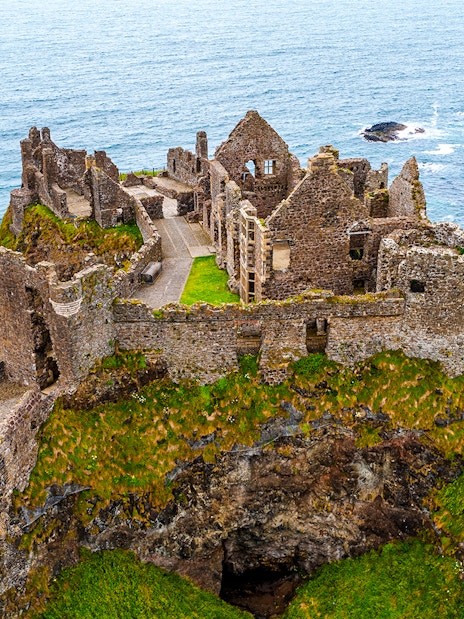 Dunluce Castle ruins on a coastal cliff in Northern Ireland.