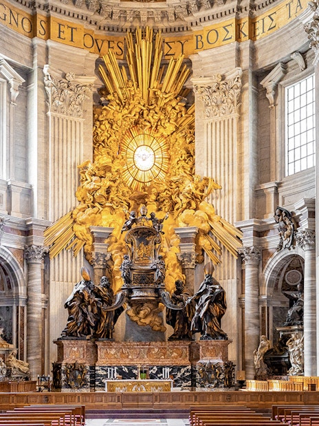 Chair of Saint Peter in St. Peter's Basilica, Rome, with ornate sculptures and golden rays.