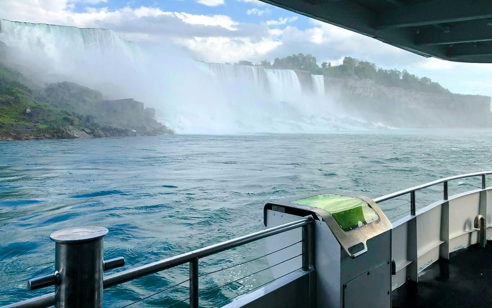 Boat view approaching Niagara Falls on the USA side during a tour.