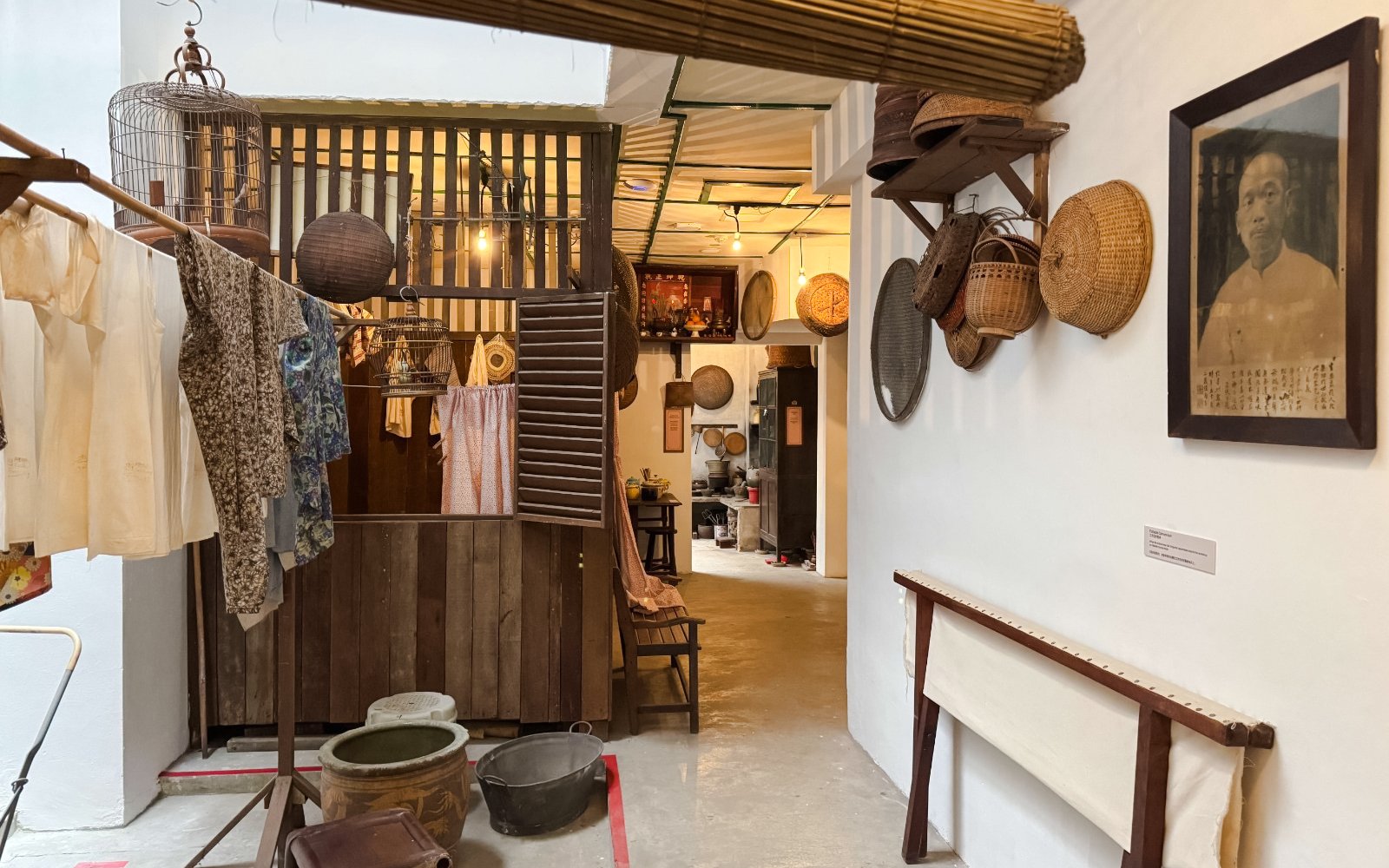 Interior of Chinatown Heritage Centre showcasing traditional household items and decor.