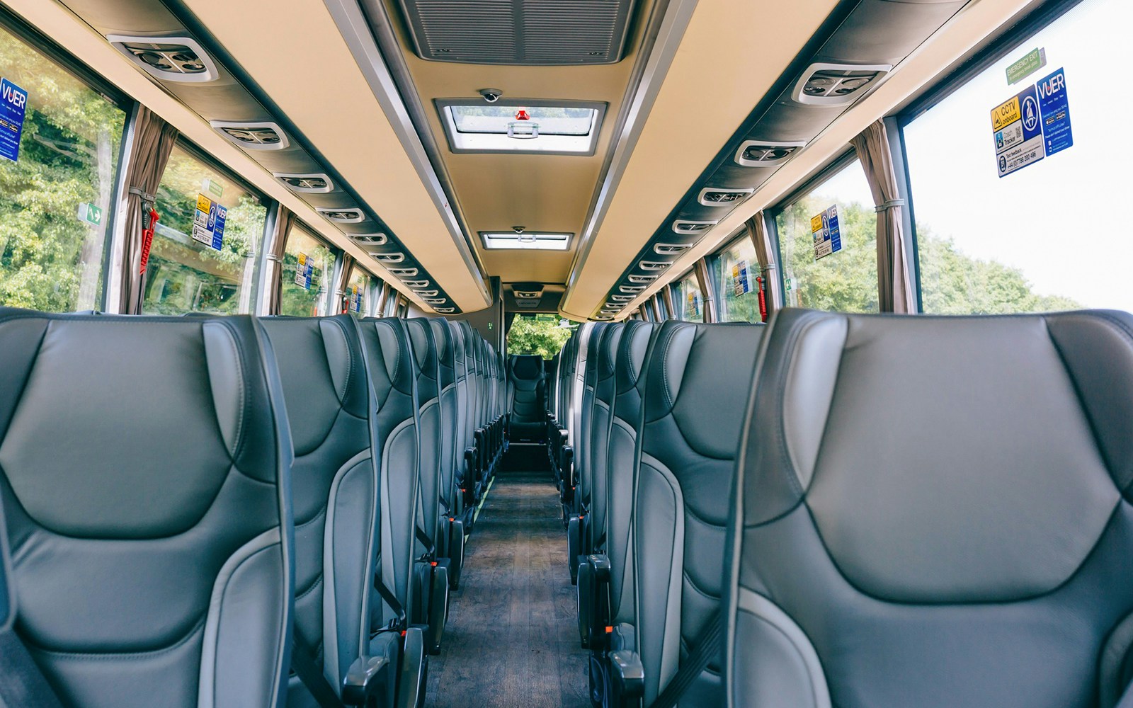 Interior of a tour bus with empty seats, en route to Windsor Castle from Central London.