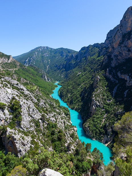 Verdon Gorge aerial view with turquoise river winding through rocky cliffs in Provence, France.