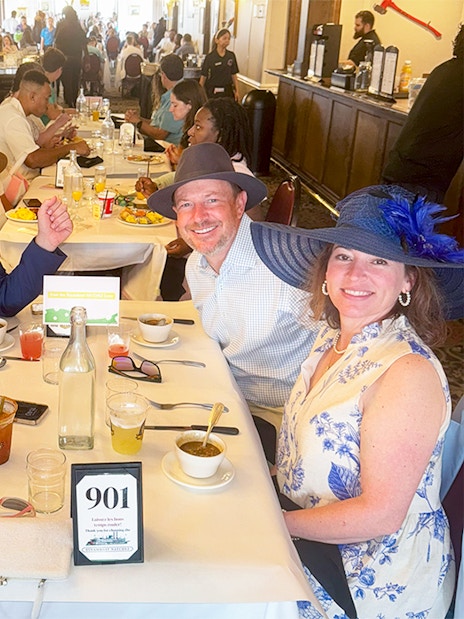 Guests enjoying brunch on Steamboat Natchez in a lively dining room.