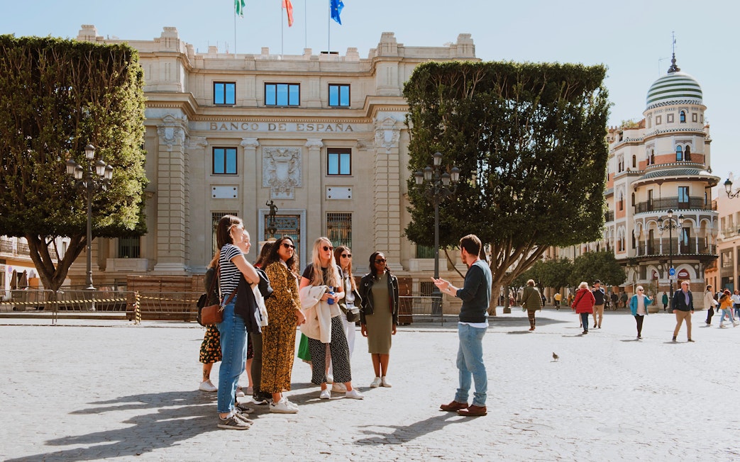 Group on a walking tour near Seville City Hall in Spain.