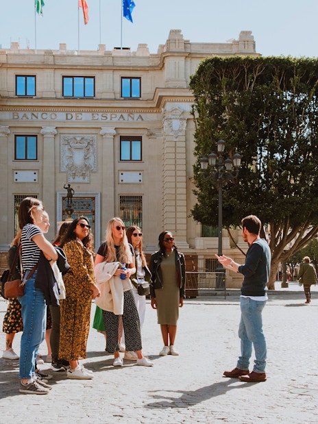 Group on a walking tour near Seville City Hall in Spain.