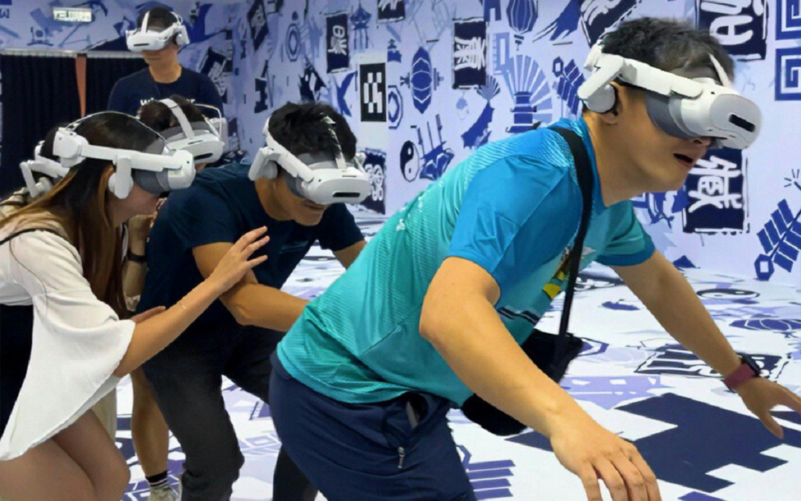 Visitors experiencing virtual reality tour, DaVinci and The Wheel of Time, with headsets.
