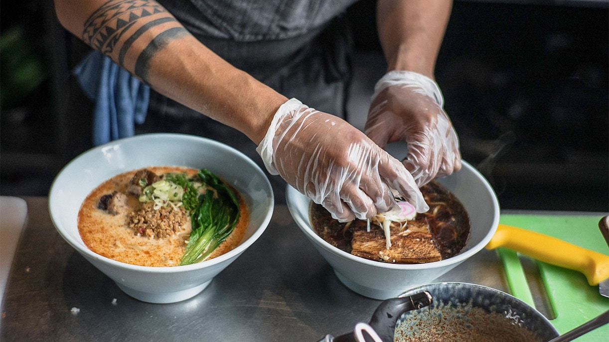 Chef preparing ramen bowls on Tokyo Ultimate Ramen Tasting Tour.
