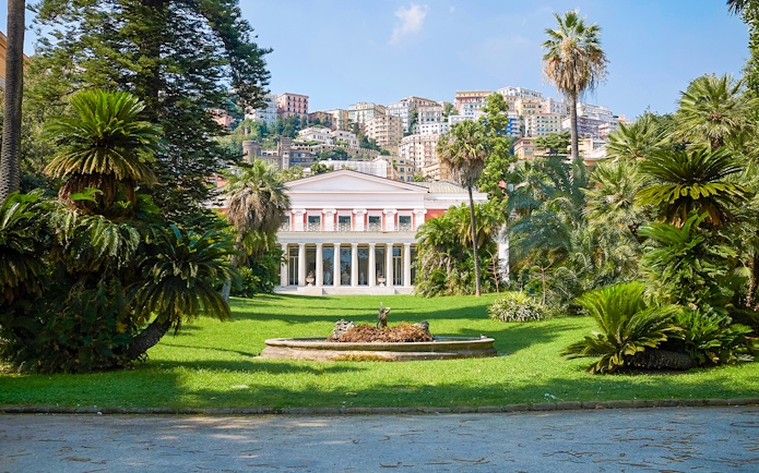 Villa Pignatelli facade with garden and fountain in Naples, Italy.