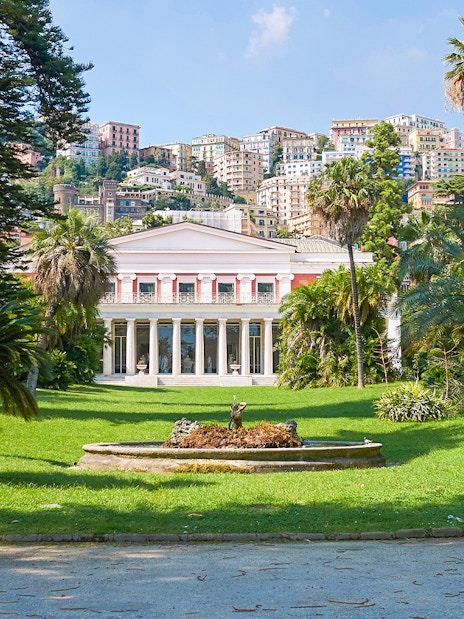 Villa Pignatelli facade with garden and fountain in Naples, Italy.
