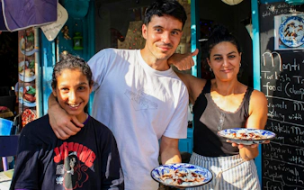 People enjoying traditional Turkish mantı during an Istanbul food tour.