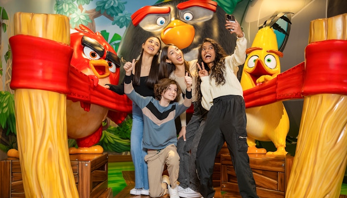 Group posing with Angry Birds characters at Angry Birds Mini Golf, American Dream.