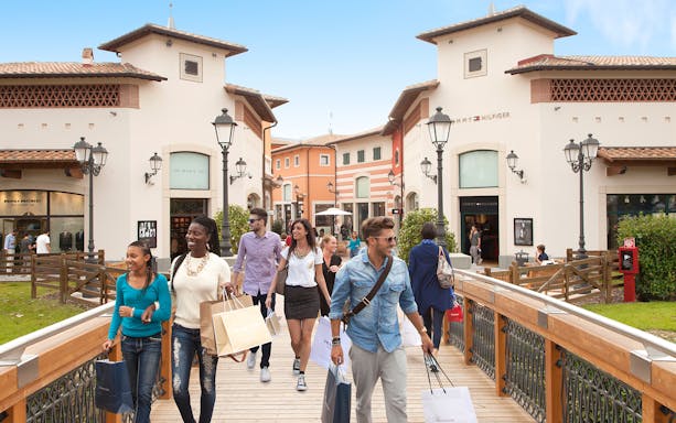 Shoppers walking at Barberino Designer Outlet near Florence.