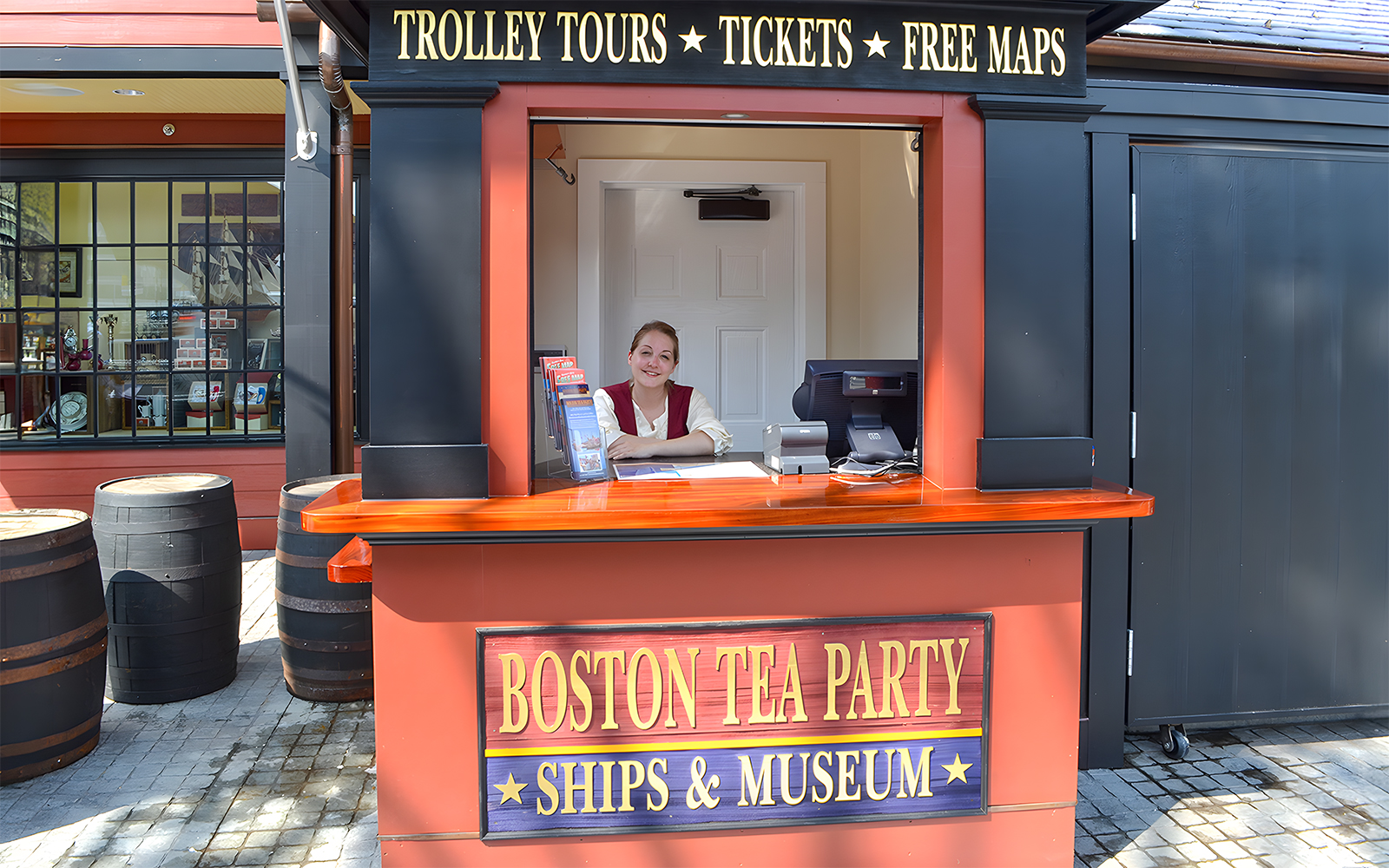 Ticket counter at Boston Tea Party Ships & Museum with staff member.
