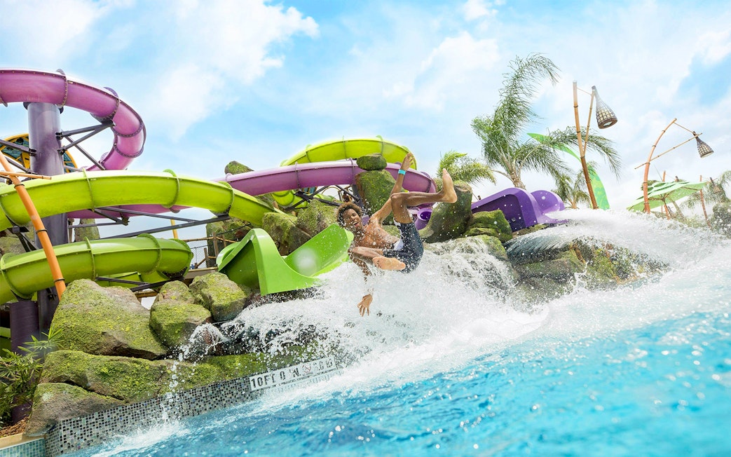 Guest enjoying a water slide at Universal Studios Resort Orlando, Florida.