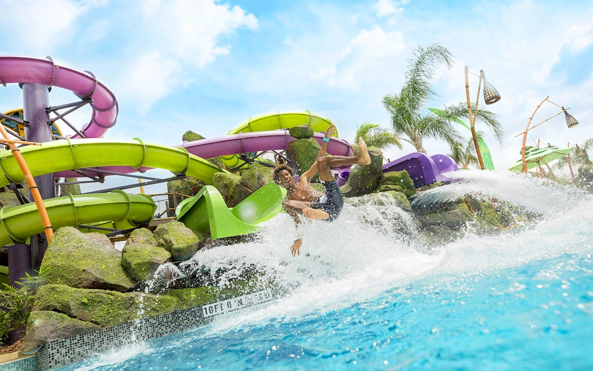 Guest enjoying a water slide at Universal Studios Resort Orlando, Florida.