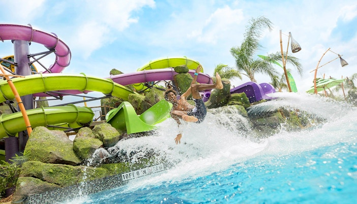 Guest enjoying a water slide at Universal Studios Resort Orlando, Florida.