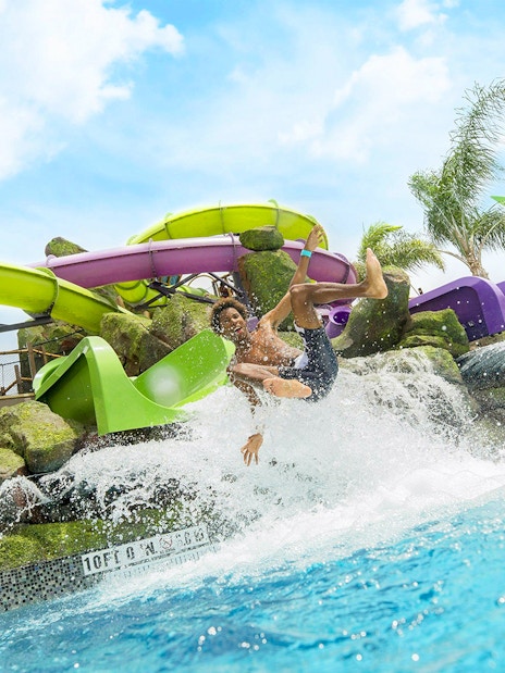 Guest enjoying a water slide at Universal Studios Resort Orlando, Florida.