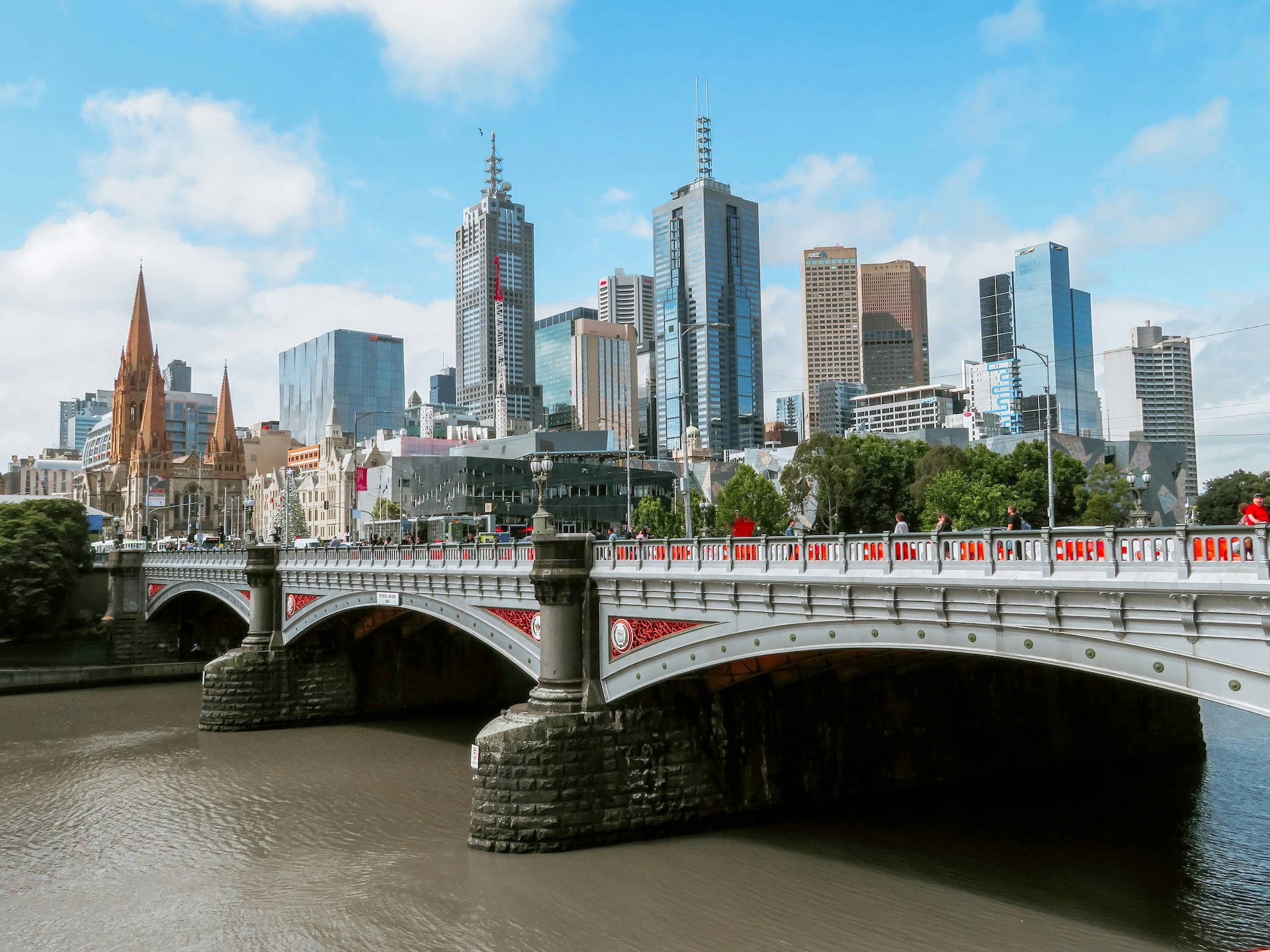 Melbourne skyline with St. Paul's Cathedral and Princes Bridge over the Yarra River.