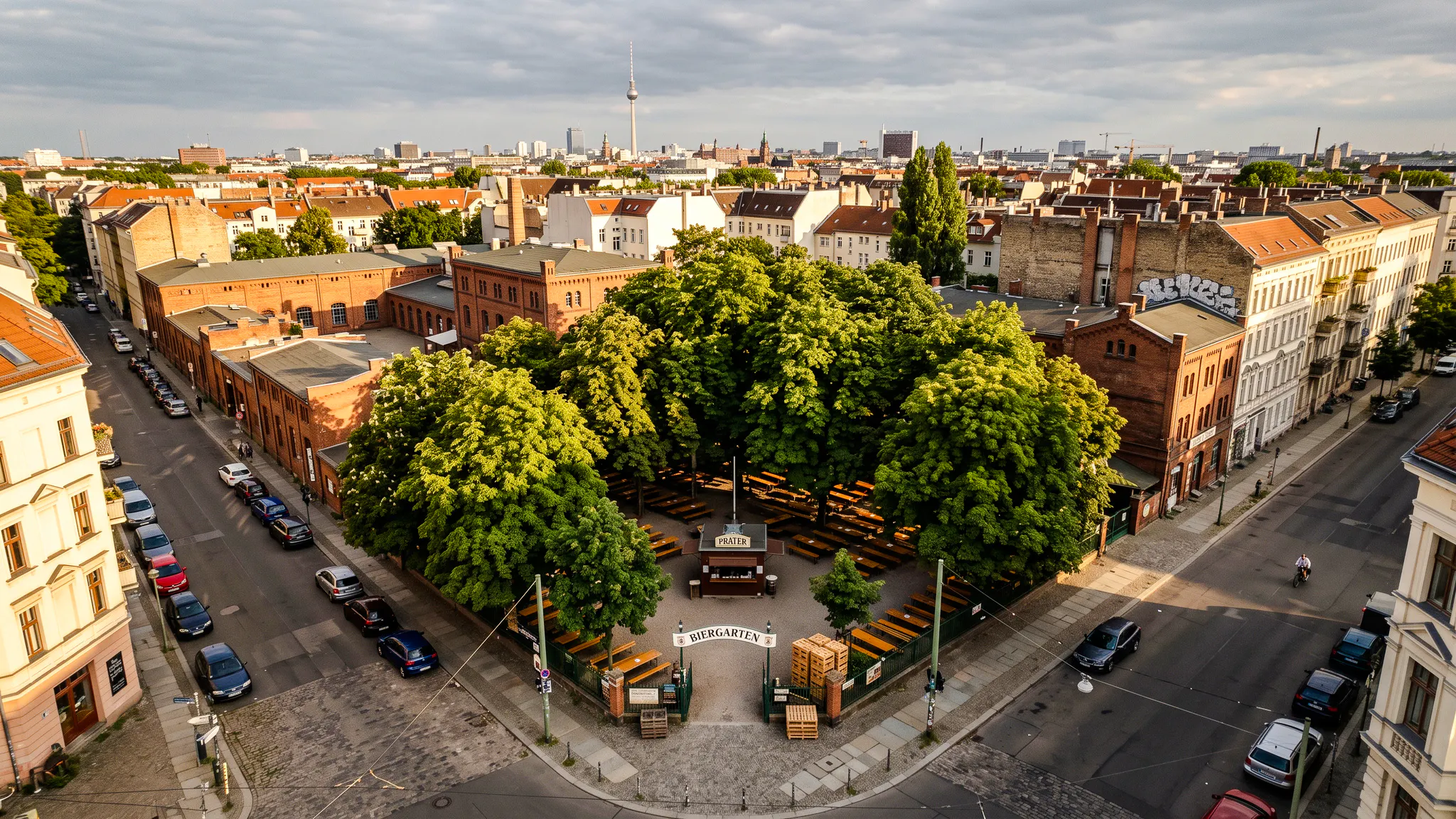 Aerial view of Prater Garten beer garden surrounded by trees in Berlin.