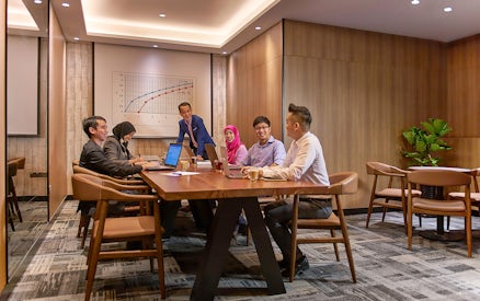 Group meeting in a conference room at Plaza Premium First, Satellite Terminal.