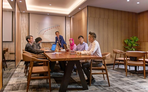 Group meeting in a conference room at Plaza Premium First, Satellite Terminal.