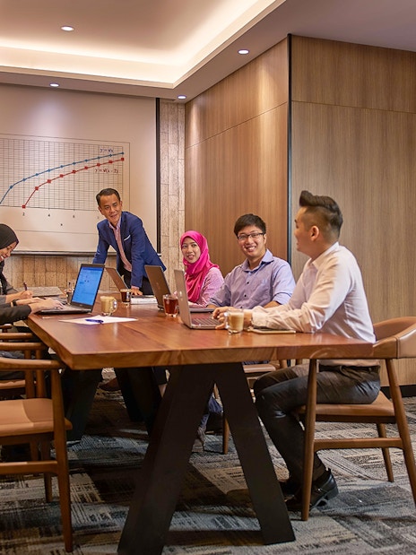 Group meeting in a conference room at Plaza Premium First, Satellite Terminal.