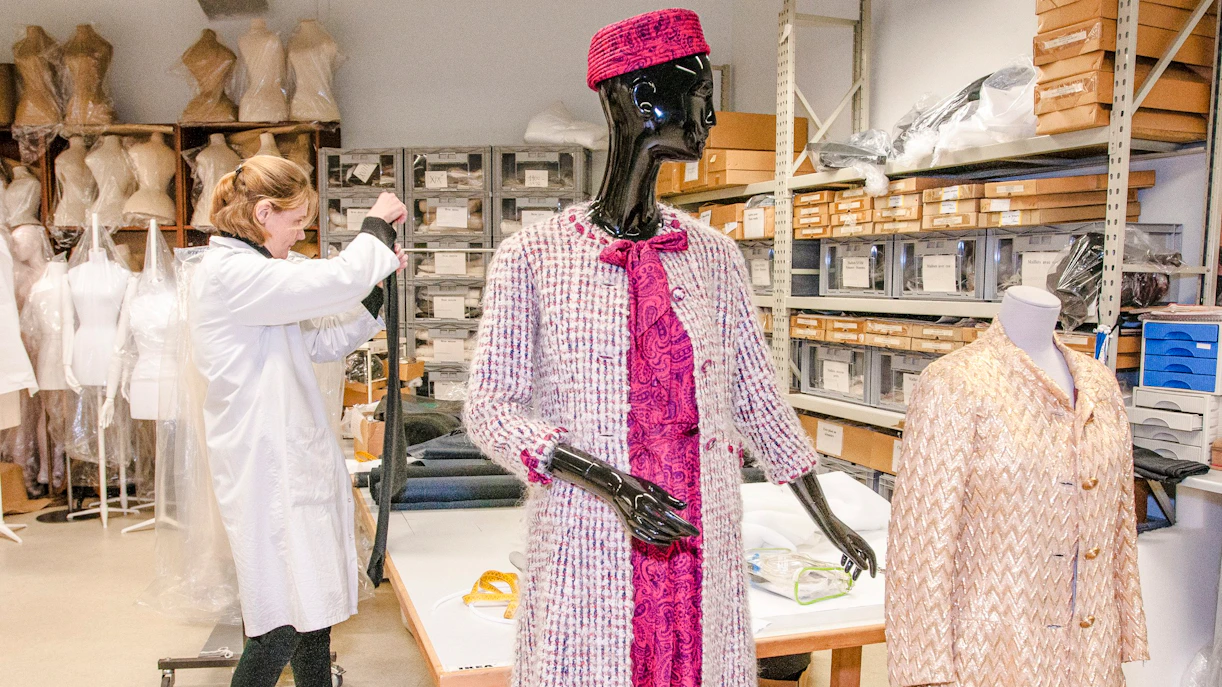 Mannequin in vintage attire at Palais Galliera fashion museum workspace.