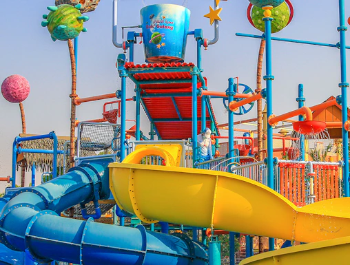 Colorful water slides and play structures at Al Montazah Water Park, Sharjah.
