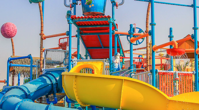 Colorful water slides and play structures at Al Montazah Water Park, Sharjah.