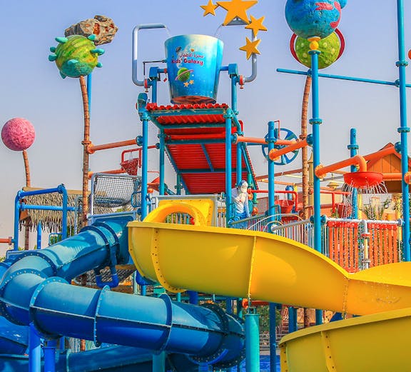 Colorful water slides and play structures at Al Montazah Water Park, Sharjah.