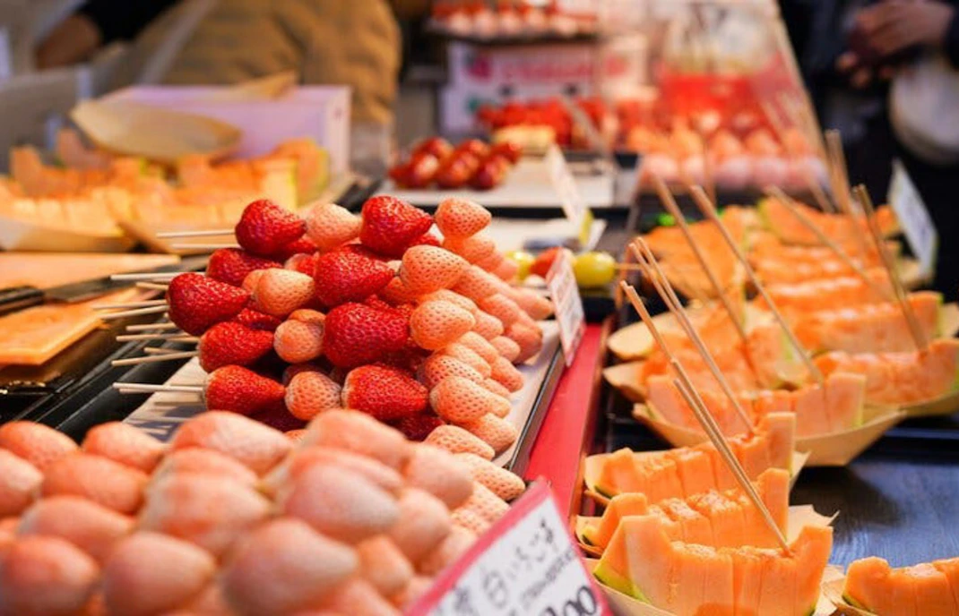 Fresh fruit skewers at Tsukiji Market, Tokyo, part of the 5-hour Tsukiji, Akihabara & Asakusa Tour.