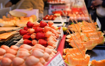 Fresh fruit skewers at Tsukiji Market, Tokyo, part of the 5-hour Tsukiji, Akihabara & Asakusa Tour.