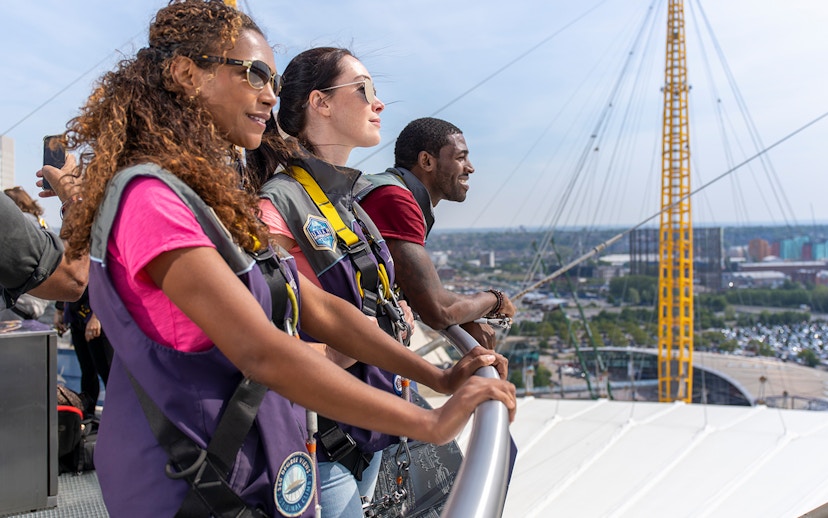 Guests enjoying the view from the O2 rooftop in London during daytime.