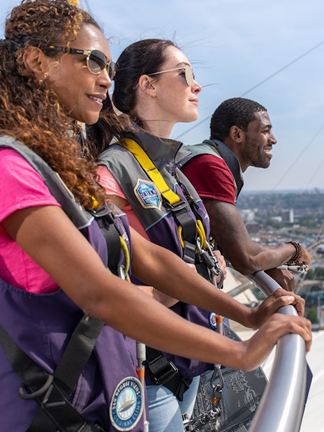 Guests enjoying the view from the O2 rooftop in London during daytime.
