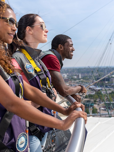 Guests enjoying the view from the O2 rooftop in London during daytime.