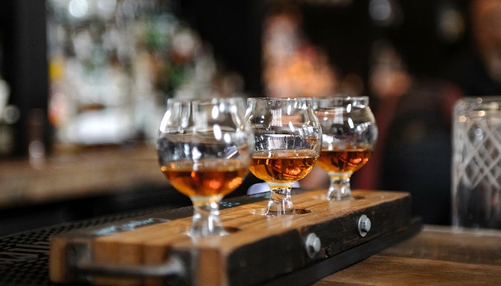 Jameson Distillery Bow St. interior with hop-on hop-off bus in Dublin.