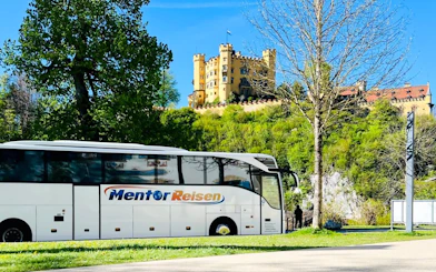 AC coach parked near Hohenschwangau Castle, Germany.