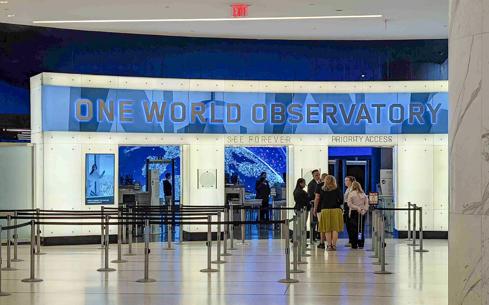 Entrance to One World Observatory with visitors in line, New York City.