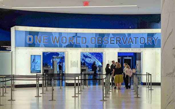 Entrance to One World Observatory with visitors in line, New York City.