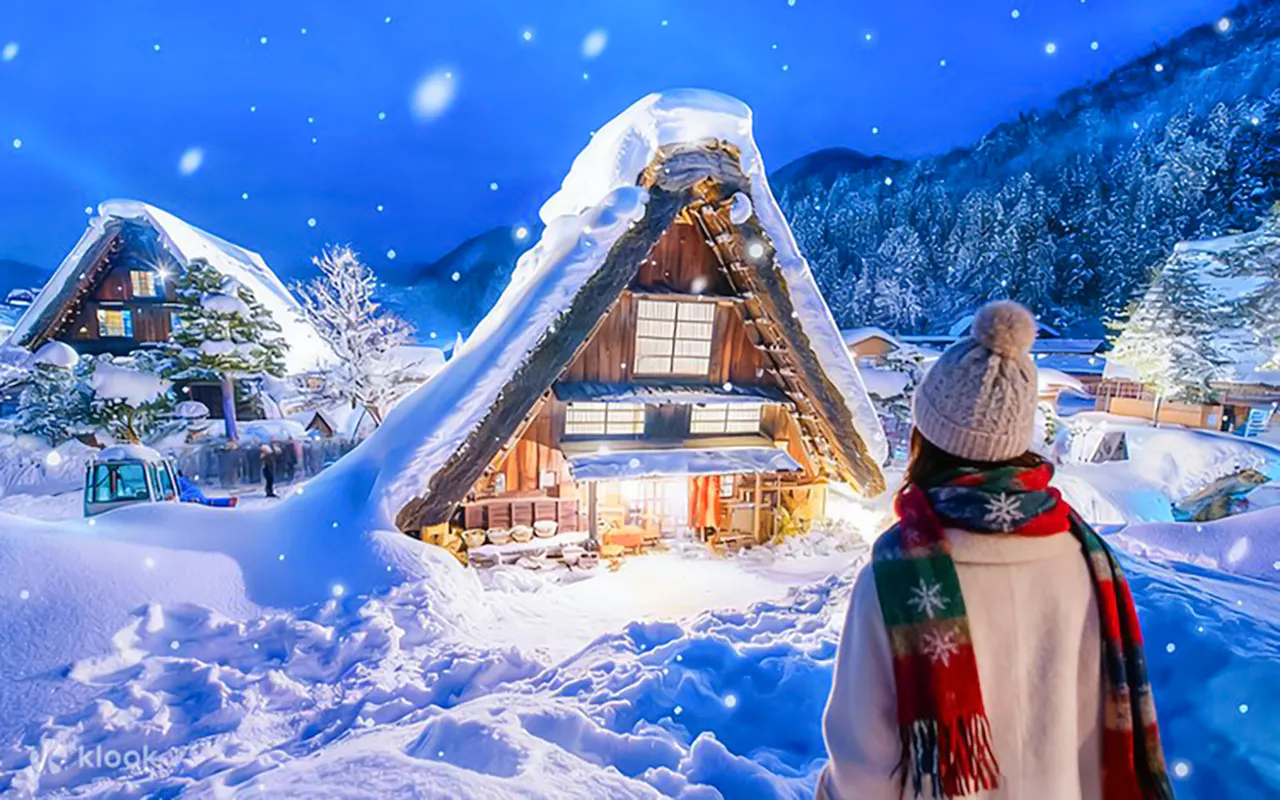 Traditional gassho-style house illuminated in snow, Shirakawa-go, during Nagoya day trip.