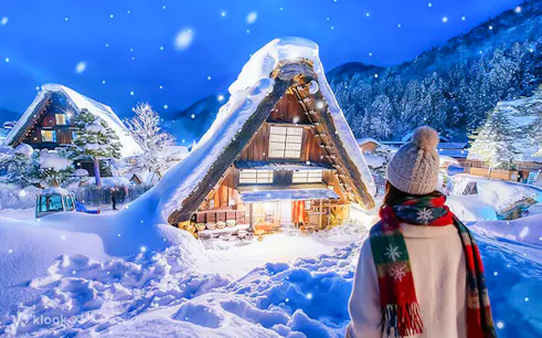 Traditional gassho-style house illuminated in snow, Shirakawa-go, during Nagoya day trip.