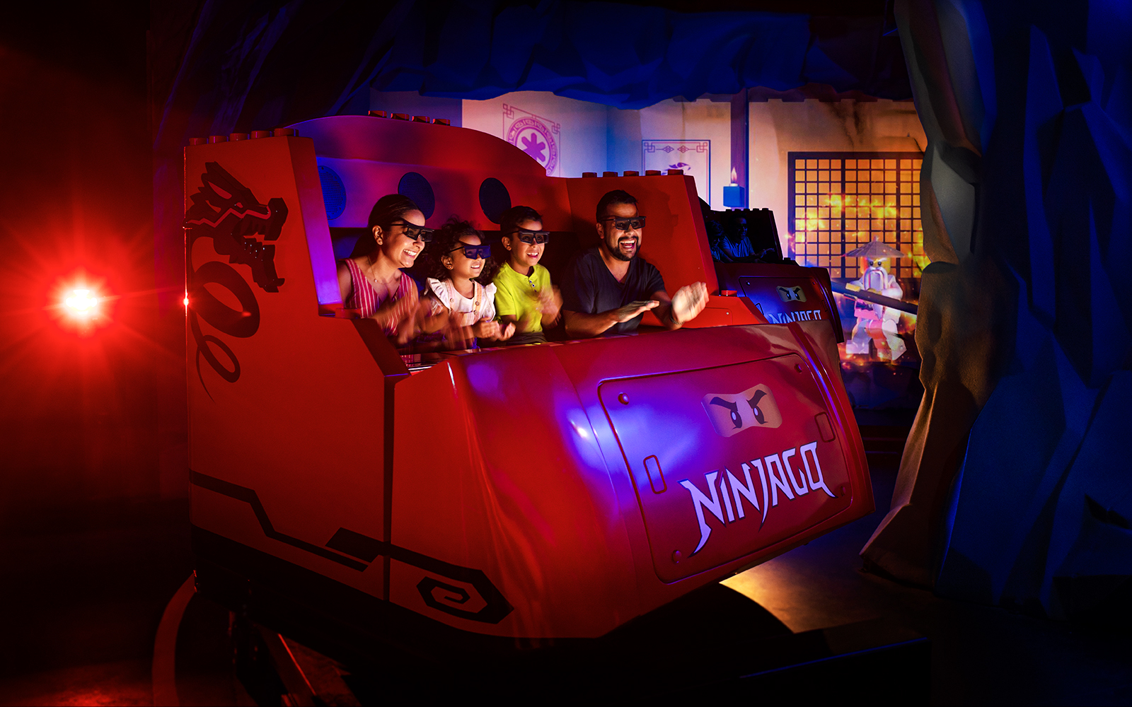 Visitors enjoying LEGO NINJAGO: The Ride at Legoland Florida.