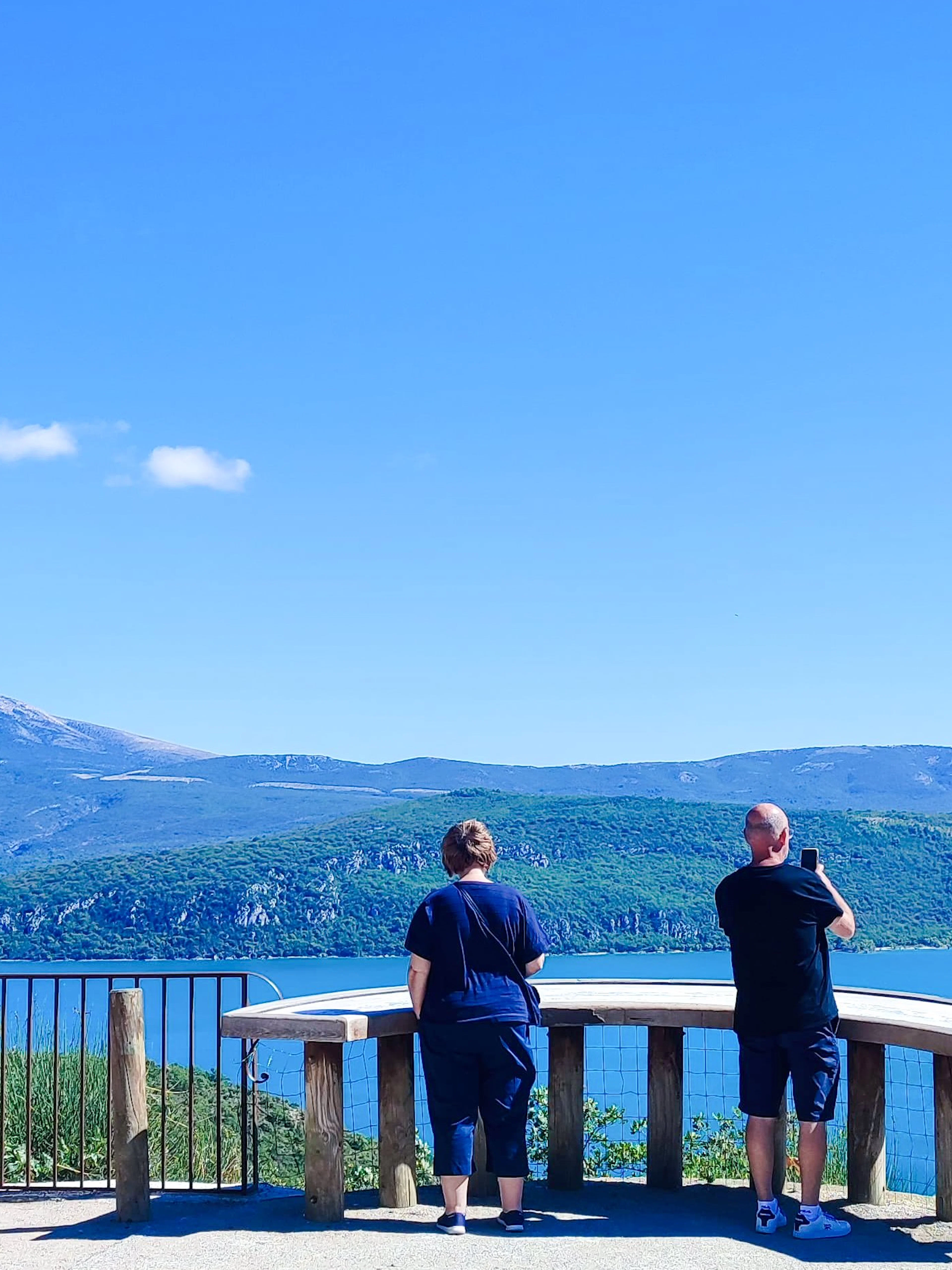 Visitors enjoying the view of Lac de Sainte-Croix near Moustiers-Sainte-Marie, Provence, France.