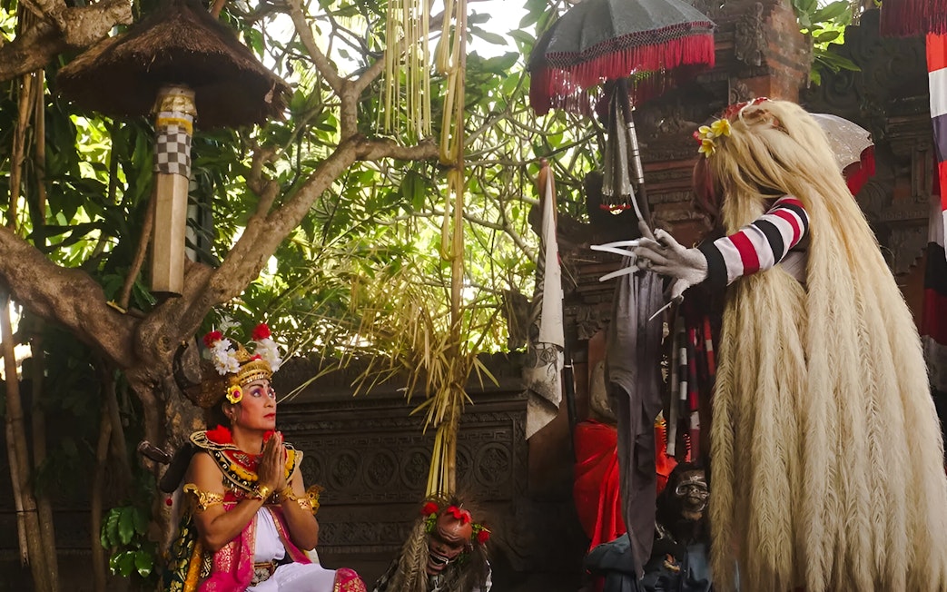 Performer in traditional costume during Uluwatu Kecak & Fire Dance Show, Bali.