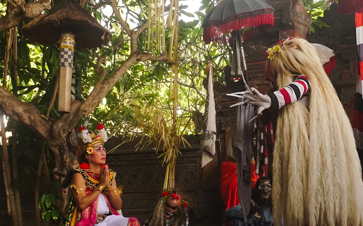 Performer in traditional costume during Uluwatu Kecak & Fire Dance Show, Bali.